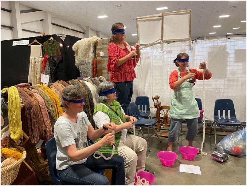 Spindle spinning blindfolded. Photos: Janet Heppler.